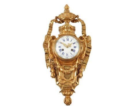  LATE 19TH CENTURY the white enamel dial with Roman numerals and Arabic five minute markers, the case surmounted by an urn wi