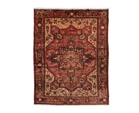  NORTHWEST PERSIA, MODERN the light red field with brown star medallion, cream spandrels, within brown border 298cm x 243cm  