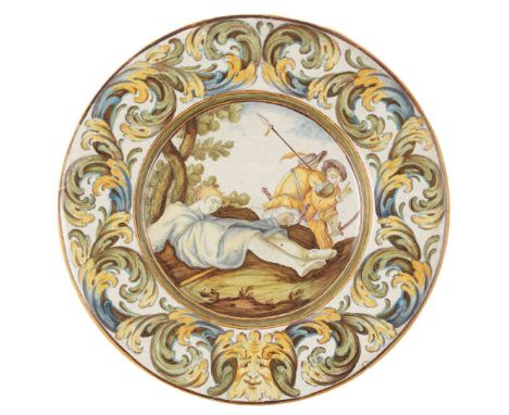  SMALL CASTELLI MAIOLICA PLATE 18TH CENTURY, POSSIBLY WORKSHOP OF GRUE painted in the centre with a scene depicting 'the man 