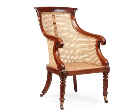  EARLY 19TH CENTURY the curved caned back and enclosed scrolling arms above a caned seat, raised on ring turned tapered legs 