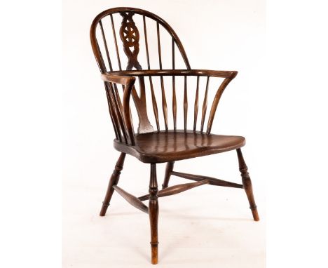 A stick and pierced splat back armchair with a solid elm seat, on turned legs CONDITION REPORT: Condition information is not 