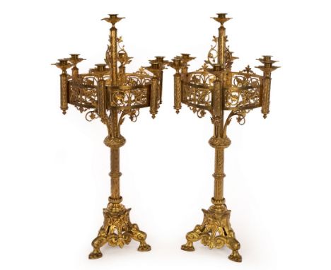 A pair of Gothic Revival style brass table candelabra, 75cm high/see illustration CONDITION REPORT: These are very light and 