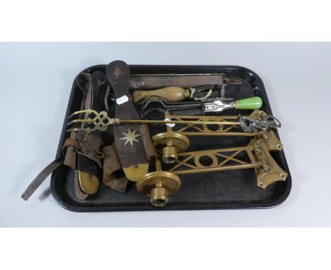 A Tray of Vintage Metalwares to Include Pair of Brass Piano Sconces, Brass Spring Balance, Ice Skating Mounts 