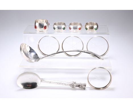 A GROUP OF SILVER AND PLATE, comprising four white-metal 'jewelled' napkin rings; a large Viners plated ladle; a set of four 
