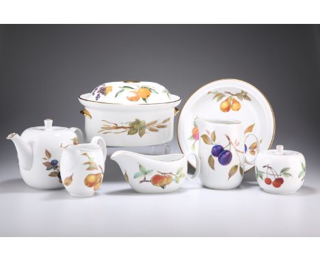 A ROYAL WORCESTER EVESHAM DINNER AND TEA SERVICE, including dinner plates, luncheon plates, teapot, six cups and saucers, etc