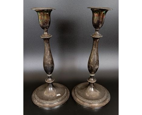A pair of George III silver candlesticks, monogrammed, Sheffield 1797, 31 cm high (2)50.66 ozt (all in)Bases do not match eac