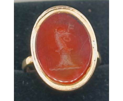 An 18ct gold and carnelian intaglio ring, ring size J