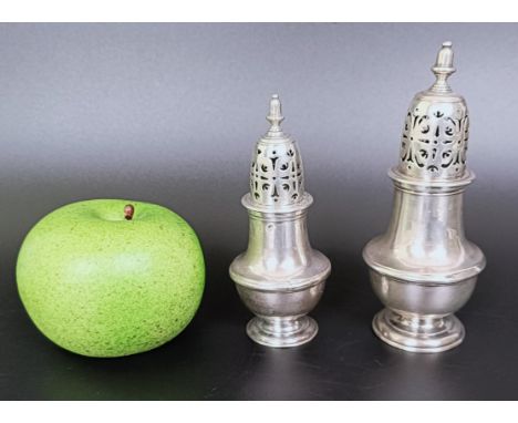 An early 19th century silver caster, marks rubbed, 13 cm high, and another similar, 10 cm high, 6.6 ozt (2)