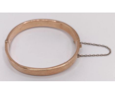 A 9ct gold bangle, 9.3 gBent and creased