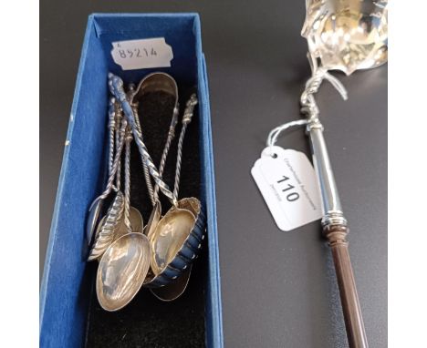 A George III silver toddy ladle, with a turned wooden handle, and assorted silver coloured metal spoons