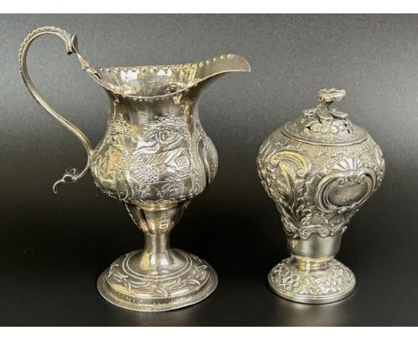 A George III silver caddy, London 1813, 2.7 ozt, 10 cm high, and an 18th century Continental silver cream jug, 12 cm high (2)