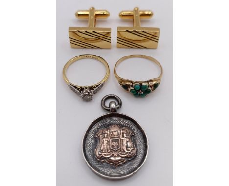 A 9ct gold and turquoise ring, a 9ct gold and diamond ring, a pair of gold plated cufflinks, and a silver medal