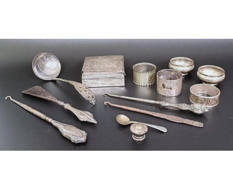 A George V silver box, with a wooden lining, three napkin rings, a ladle, and assorted other items