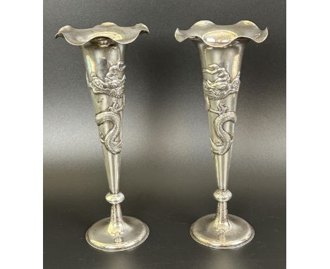 A pair of Chinese silver coloured metal vases, decorated dragons, 9.4 ozt, 22 cm high (2)