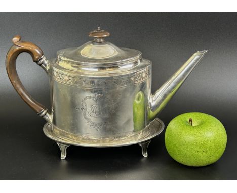A George III silver teapot and stand, monogrammed, with bright cut decoration, London 1794, 21.0 ozt (all in), the teapot 15.