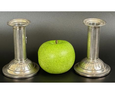 A pair of Victorian silver squat candlesticks, in the form of columns, London 1882, 11 cm high (2)