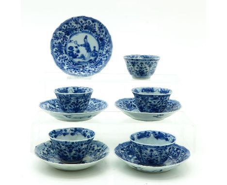 Depicting flowers and Chinese lady in garden, saucers are 11 cm. in diameter, chip and hairline.