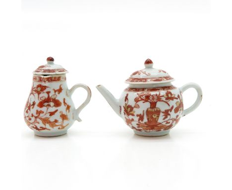 Depicting flowers in orange and gold decor, teapot is 10 cm. tall, chip.