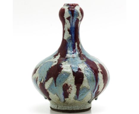 Splashes of red and light blue glaze, 30 cm. tall.