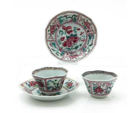 Depicting flowers, saucers are 12 cm. in diameter, chip.