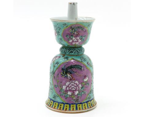 Light green ground with Famille Rose enamels depicting flowers and birds, 23 cm. tall.