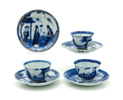 3 cups and 4 saucers, blue and gold decor of Chinese people, saucers are 10 cm. in diameter, chip and hairline.
