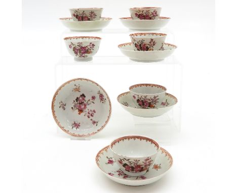 Depicting flowers, saucers are 12 cm. in diameter, chip and hairline.