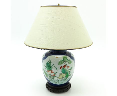 Dark blue ground with polychrome decor, lamp is 50 cm. tall.