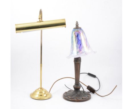 A collection of brass, ceramic and wooden table lamps, and an oak framed wall mirror.
