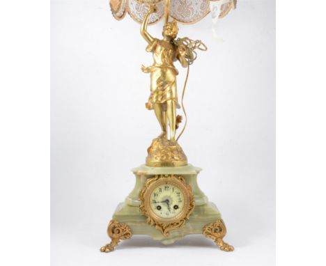 French onyx and gilt spelter mantel clock table lamp, modelled with a figure Florison after Buchot, ivorine dial movement str