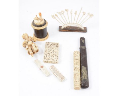 A collection of ivory items, including a carved Cantonese card case (as found), Cantonese cylindrical container, 15cm; two iv