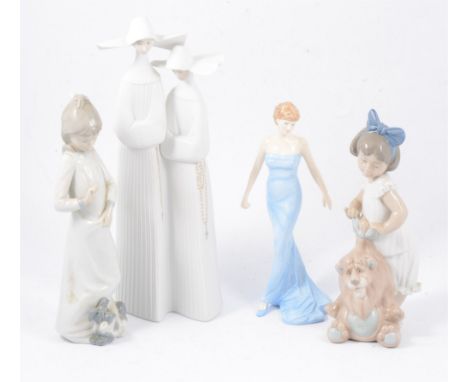 A quantity of Lladro, Nao and Doulton figures - a pair of bisque Lladro nuns, 33cm, blue gloss seated nun sewing, 21cm, Royal