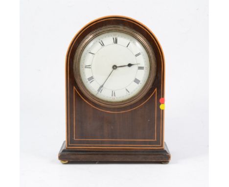 An Edwardian dome cased mantel clock, paper label for W Payne &amp; Co, London, mahogany case with box stringing, 22cm.