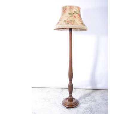 A walnut standard lamp, early 20th century, octagonal and fluted column with inlay, 147cm tall with out shade.