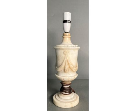 A white marble table lamp with a central sash relief 