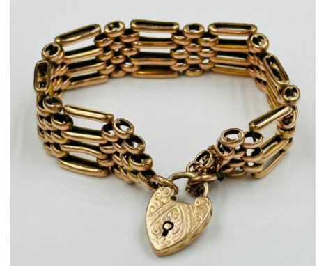 A 9ct gold gate bracelet with a heart shaped fastener with approximate total weight 24g