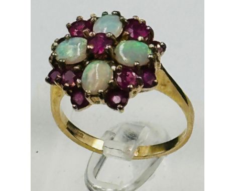 A 9ct gold opal and ruby ring, approximate size O and weight 3.9g