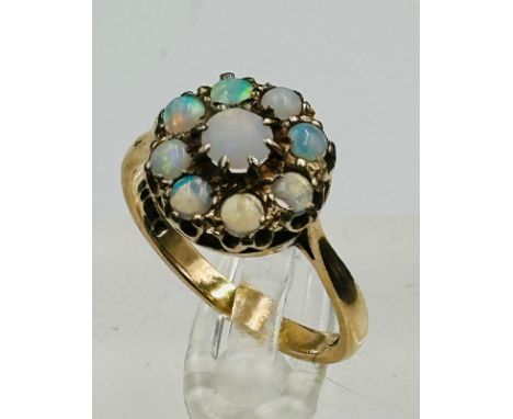 A 9ct opal daisy style ring, approximate size N with approximate weight 3.1g.