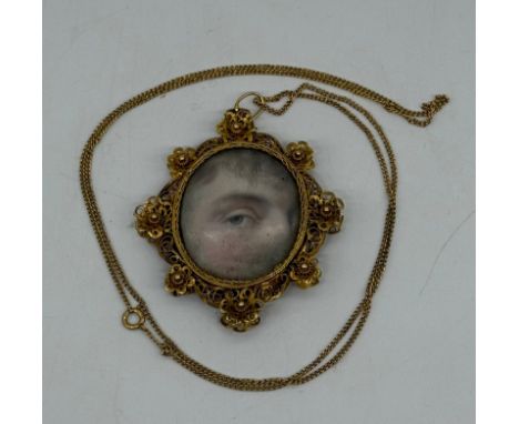 A Georgian gold-coloured metal 'Lovers Eye' painted pendant, oval with eye painting, on ivory,on a later 9ct gold necklace. P