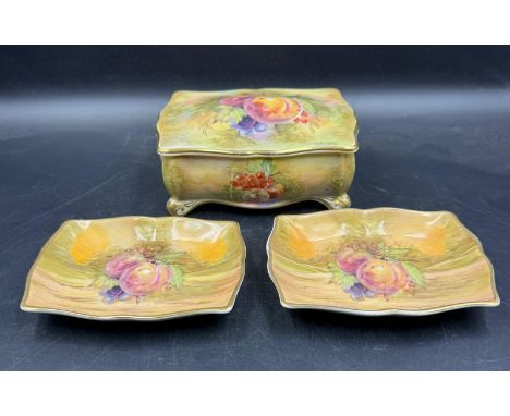 A Royal Winton hand painted "Fruit Study" candy box signed lower right and two "Fruit Study" pin dishes signed M Lut lower ri