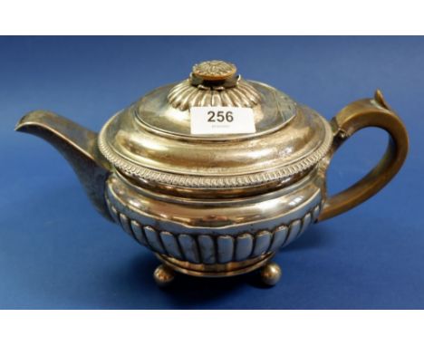 An early 19th century silver squat gadrooned teapot with flower finial, 872g, London 1807, by Daniel Pontifex 