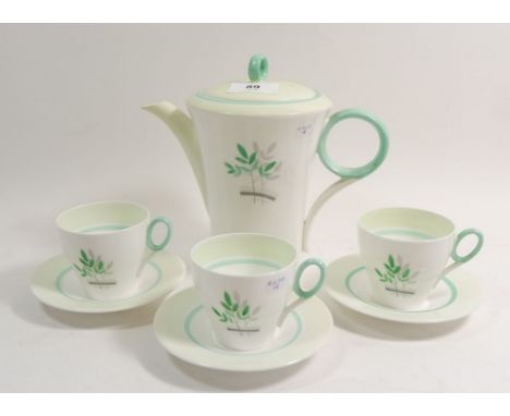 A Shelley Art Deco Regent shape coffee pot and three cups and saucers decorated leaves 