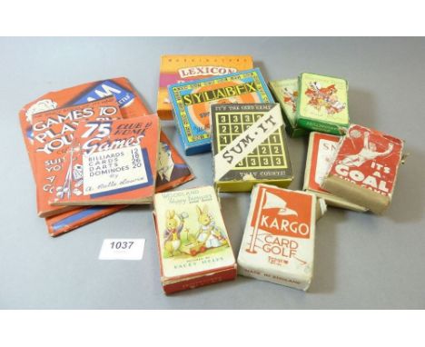 A box of vintage playing cards and games 