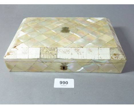 A mother of pearl clad games box with contents of counters and fitted mother of pearl cribbage board (many spare mother of pe