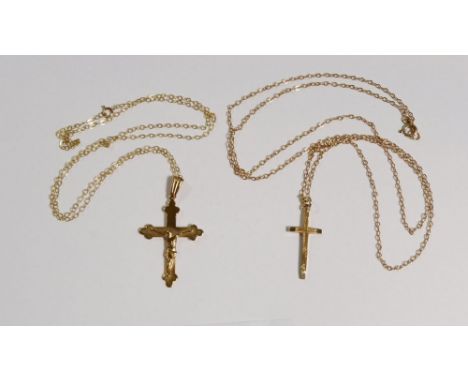 Two vintage 9 carat gold crucifix pendants and chains, marked Birmingham 1966 and 1988, 66cm and 51cm long, combined weight 5