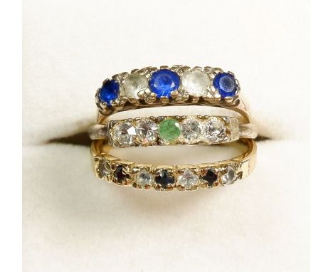 A 9 carat gold vintage ring set blue and white stones and two other gold plated dress rings 