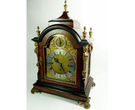 A 19th century tortoiseshell bracket clock with arch top over silvered chapter ring and silent/strike dial, three train fusee