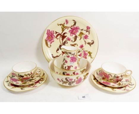 A Royal Worcester Victorian tea service with peony decoration comprising: twelve cups and saucers, twelve side plates, four s