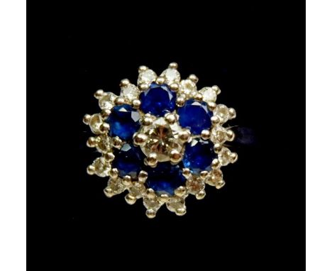 An 18 carat white gold sapphire and diamond cluster ring, size L to M 