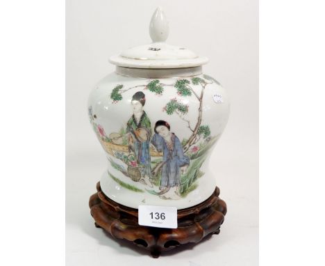 A Chinese 19th century famille rose baluster form jar and cover painted two ladies in a garden, seal mark to base, 20cm tall 